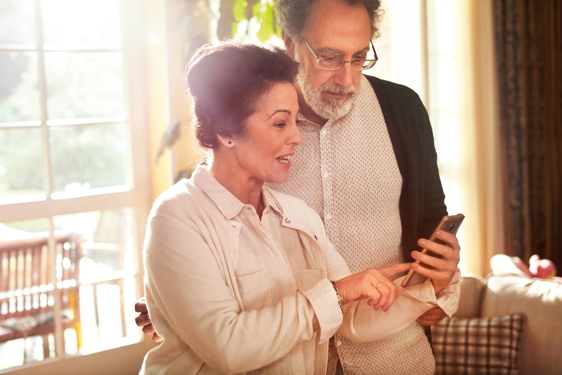 Image of couple looking at a cell phone